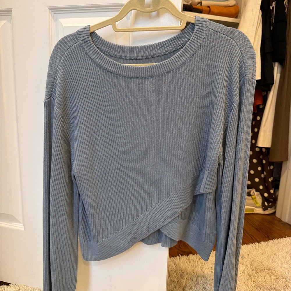 Lululemon blue/grey sweater. Can wear either way (cross in the front or back)